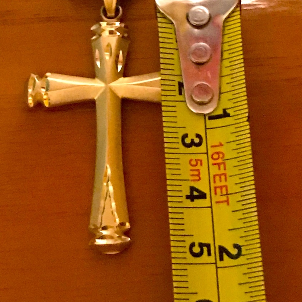 Solid 14K Gold pendant. Cross has etching on top and on both sides.